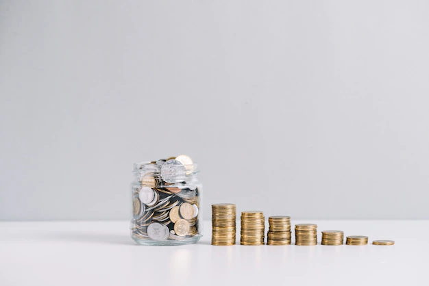 glass-jar-full-money-front-decreasing-stacked-coins-against-white-background_23-2147919228